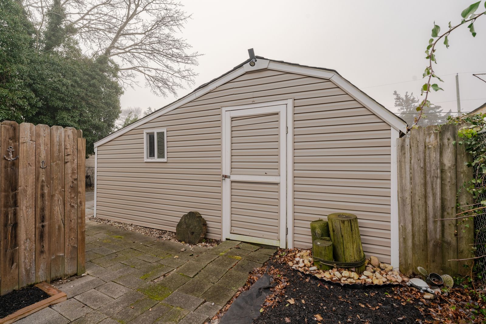 Backyard storage shed and paver patio