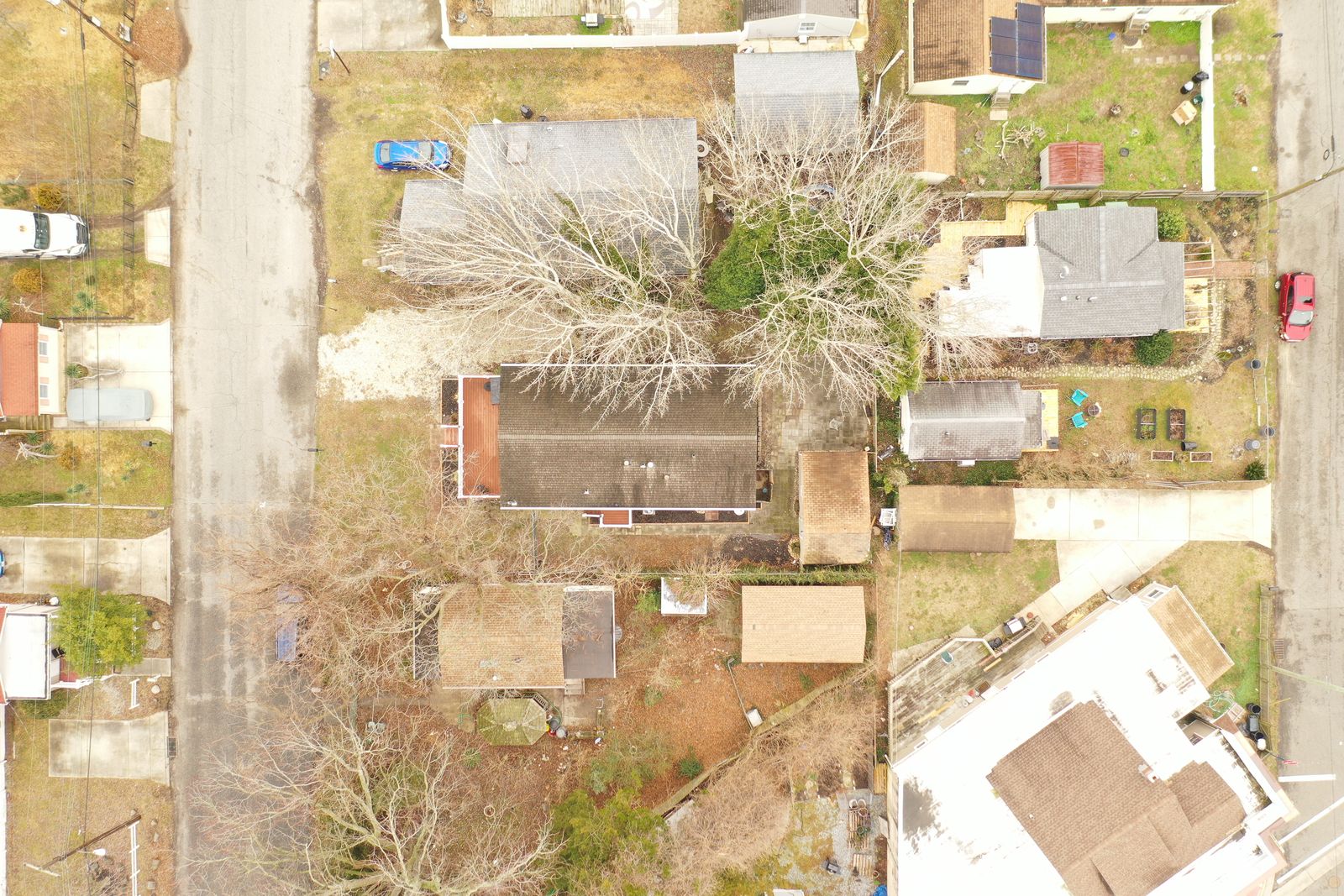 Top-down drone view of the lot and backyard