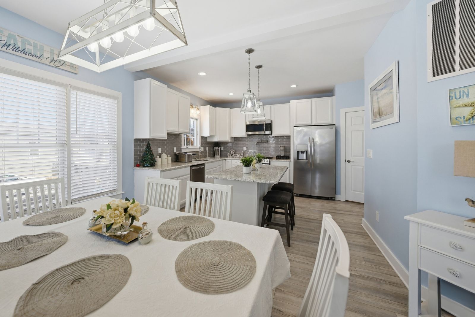 Dining area open to a white kitchen