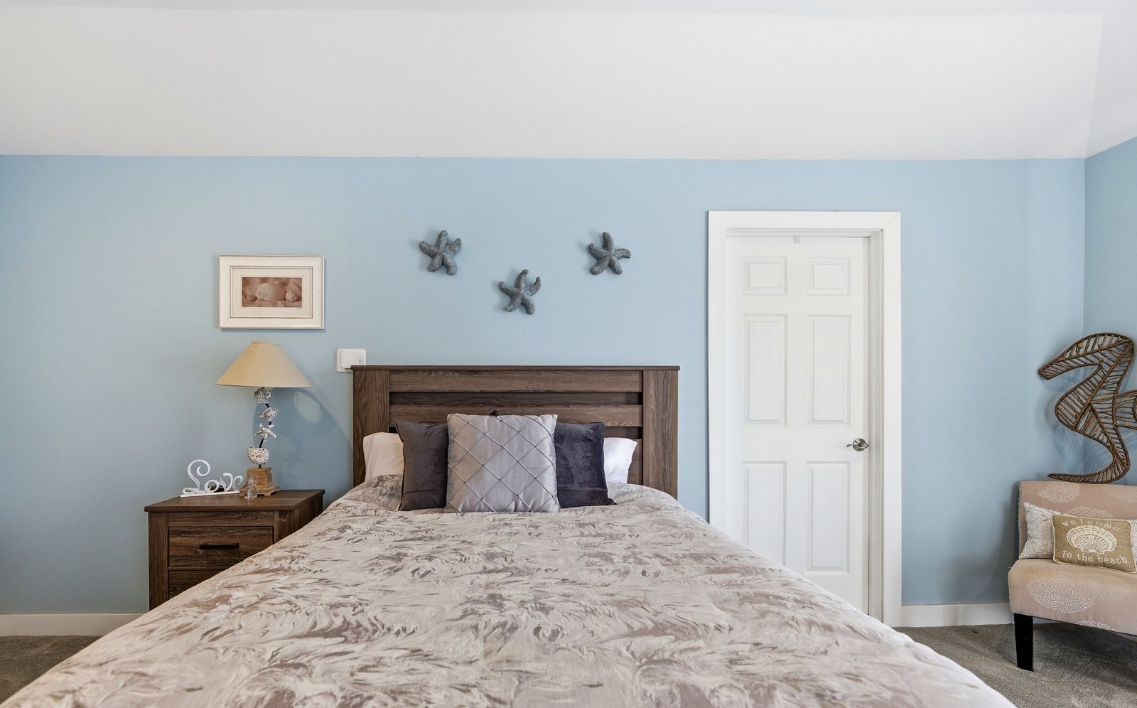 Primary bedroom with starfish wall decor