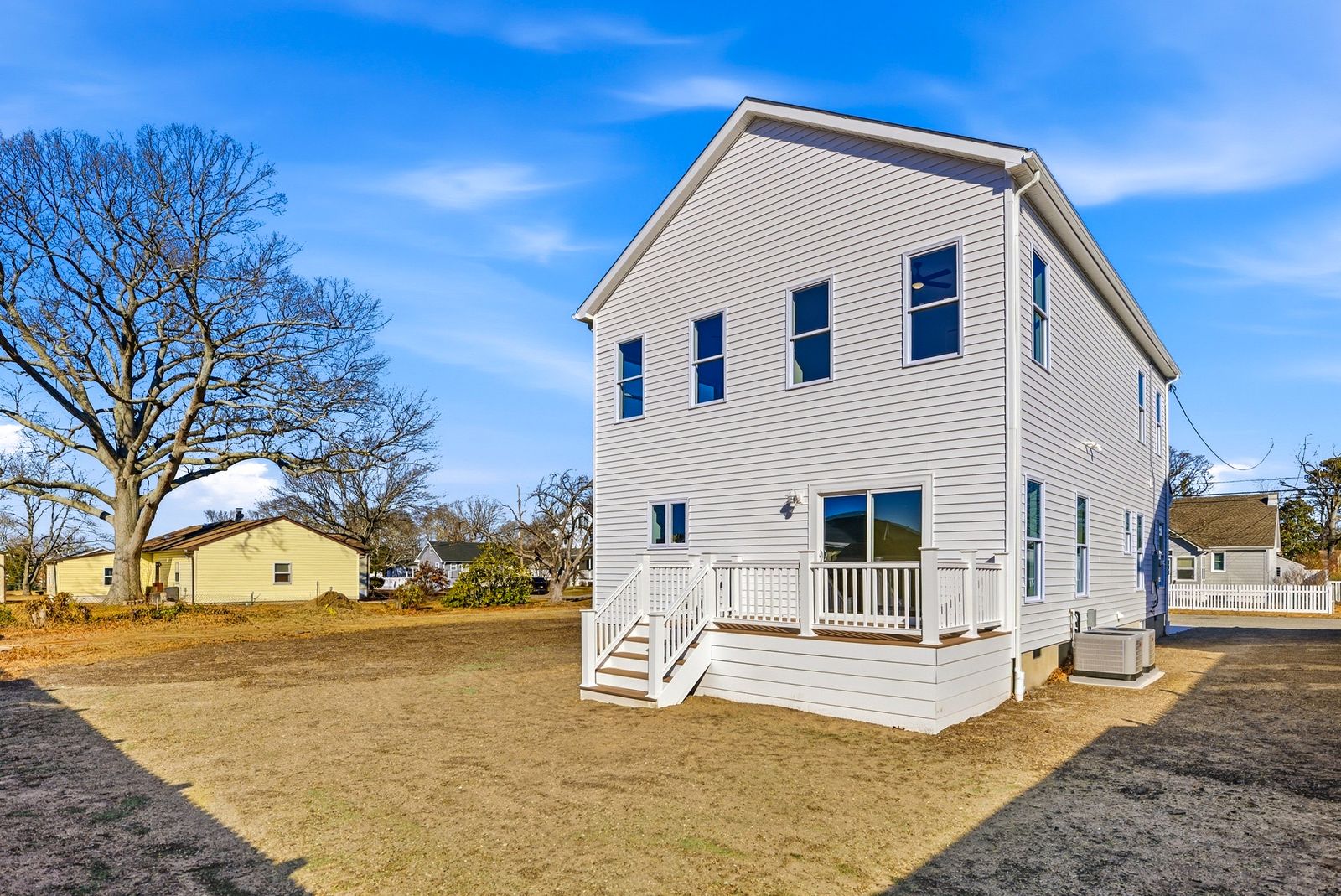 White two-story new build with front porch in Villas NJ