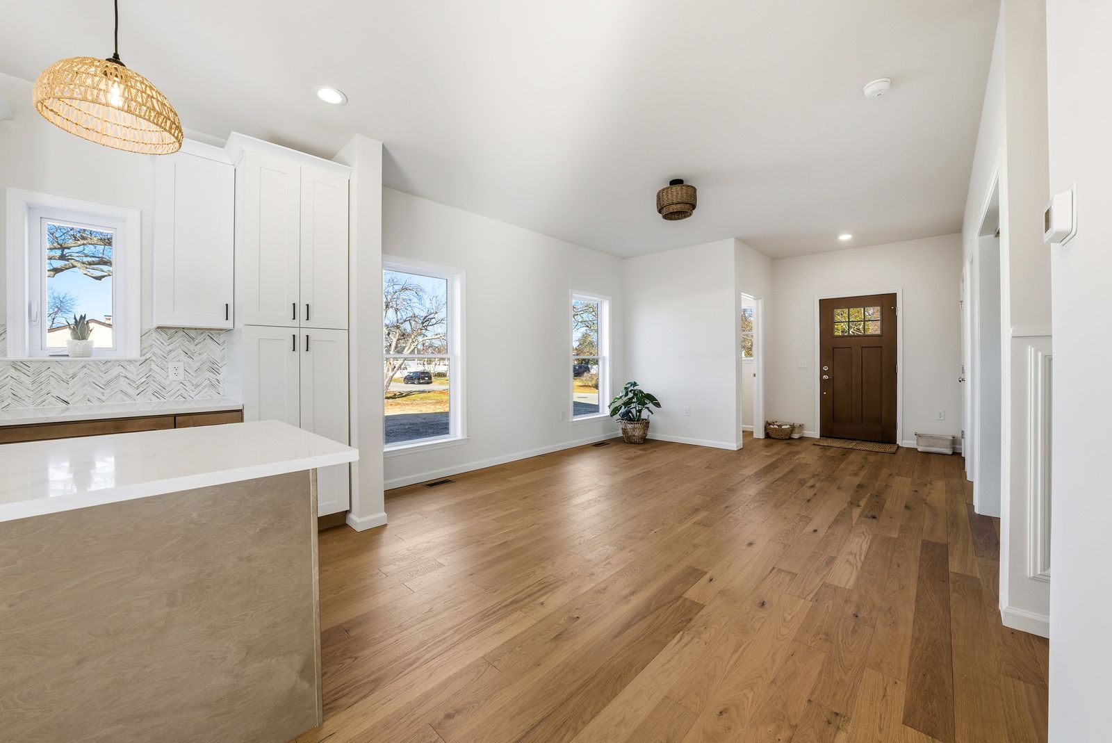 Open floor plan with white oak floors