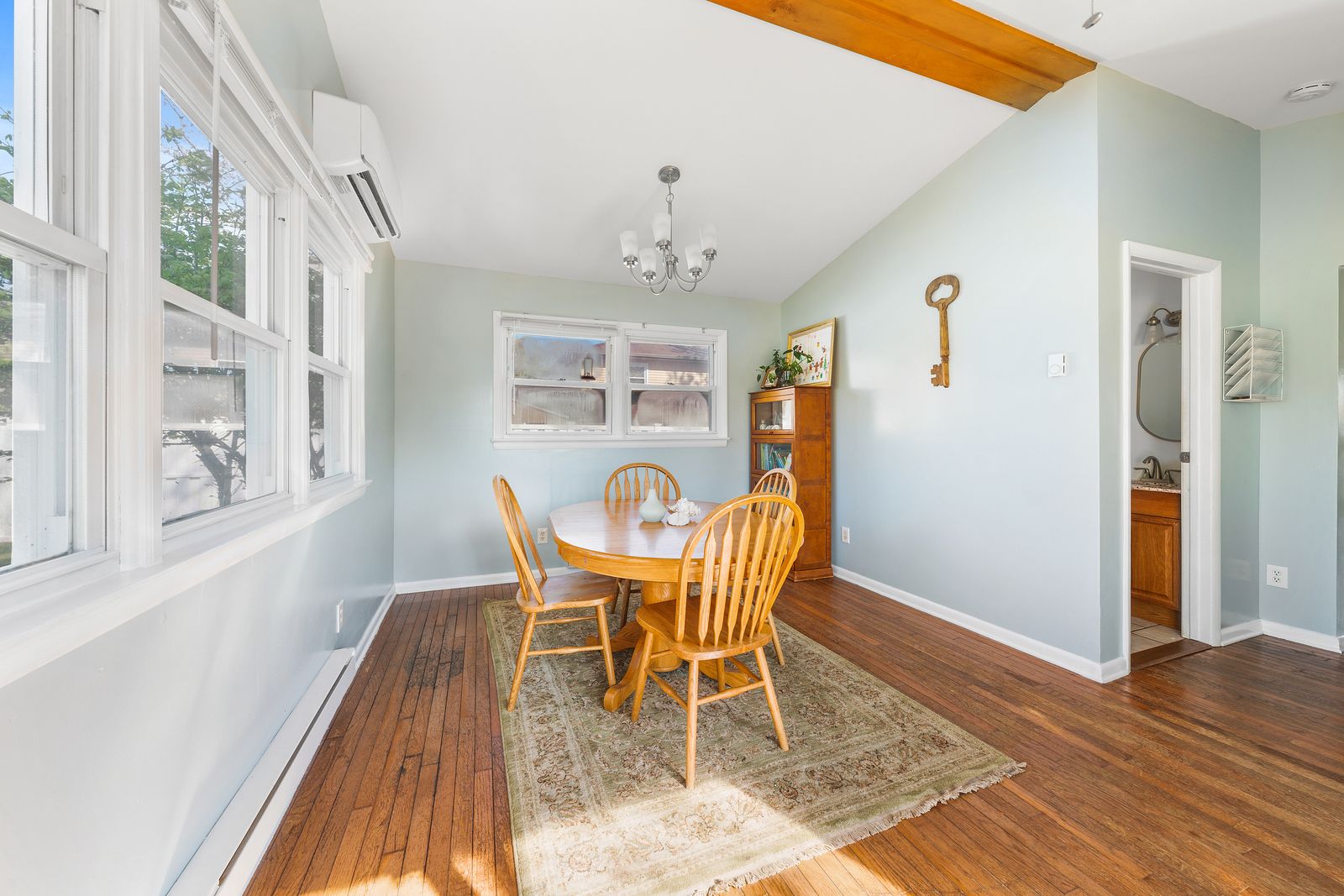 Dining room with hardwood floors and chandelier