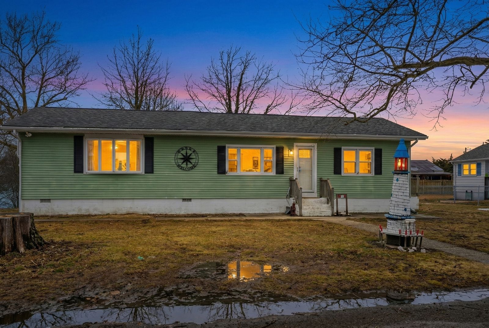 Green ranch home at virtual twilight in Villas NJ
