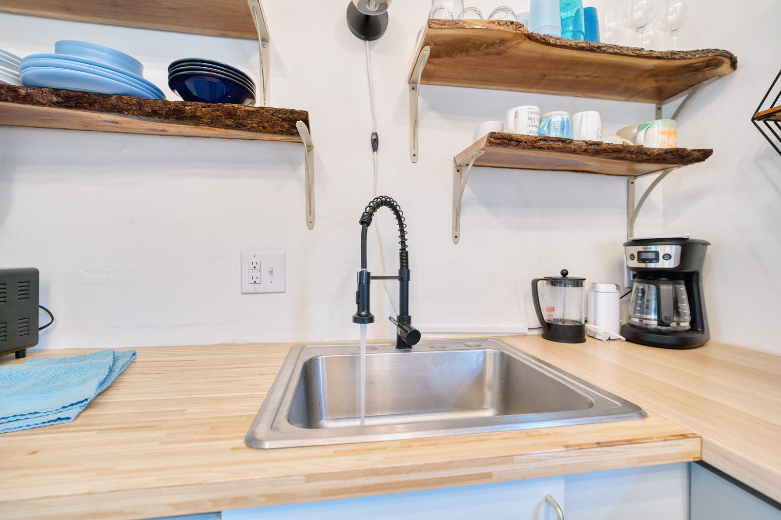 Butcher block counter with farmhouse faucet