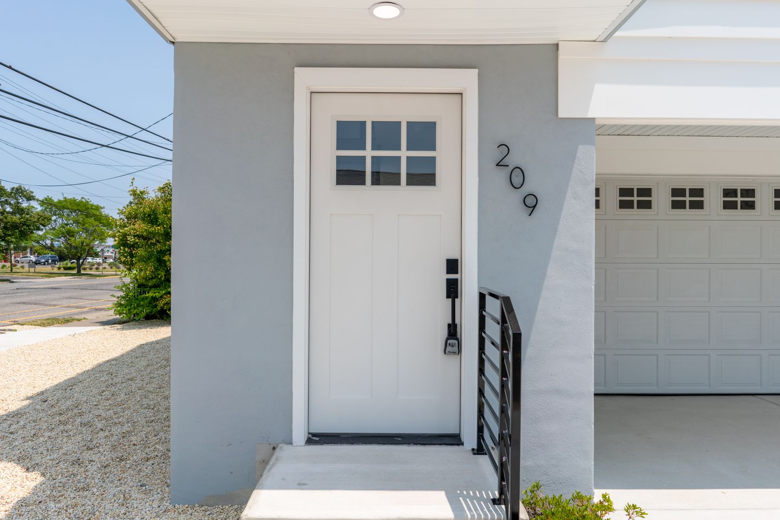 Front entry door with house number 209