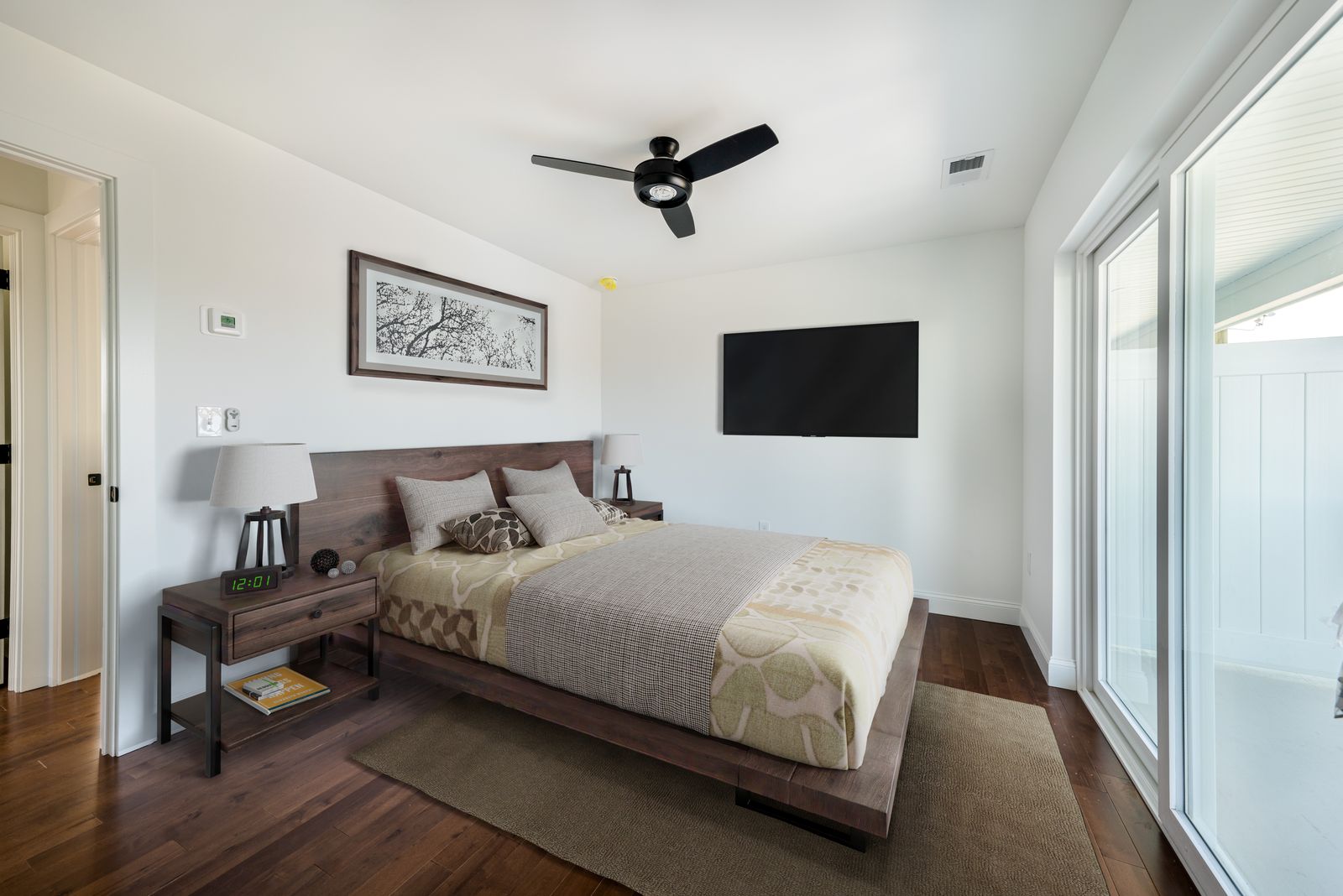 Virtually staged bedroom with bed, rug and nightstand