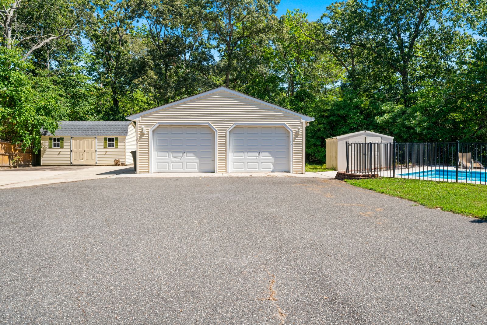 Detached two-car garage with paved driveway