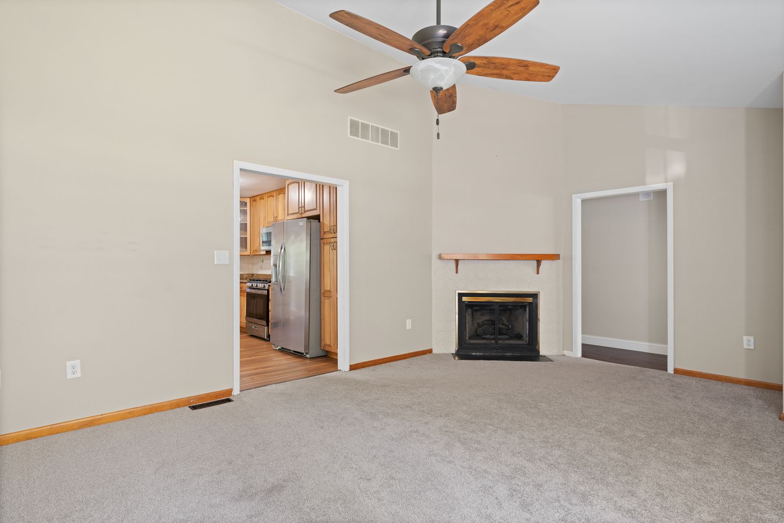 Living room with fireplace and wood mantel
