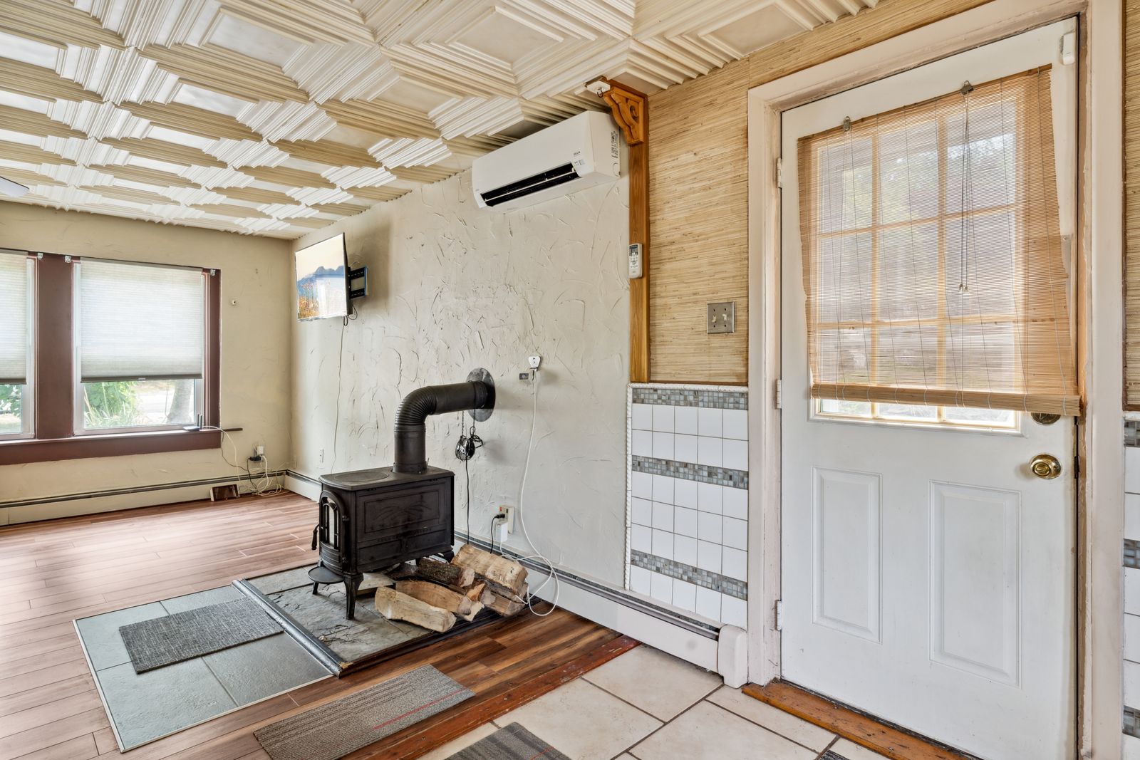 Cast iron wood stove on a tile hearth