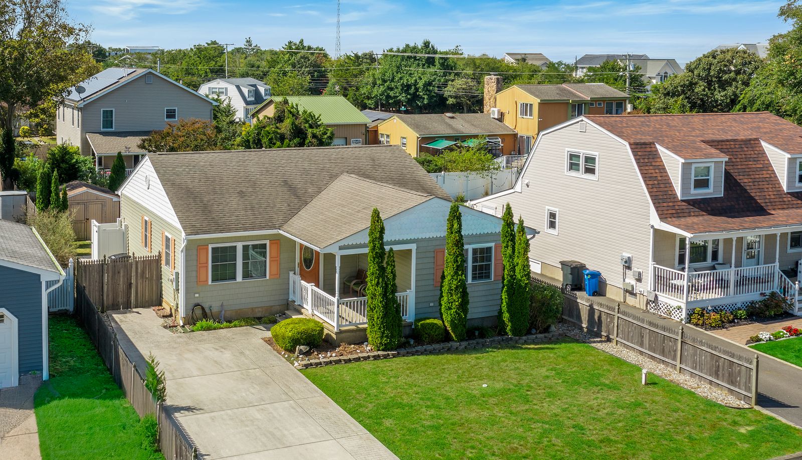 Drone view of the home, driveway and front lawn in Villas NJ