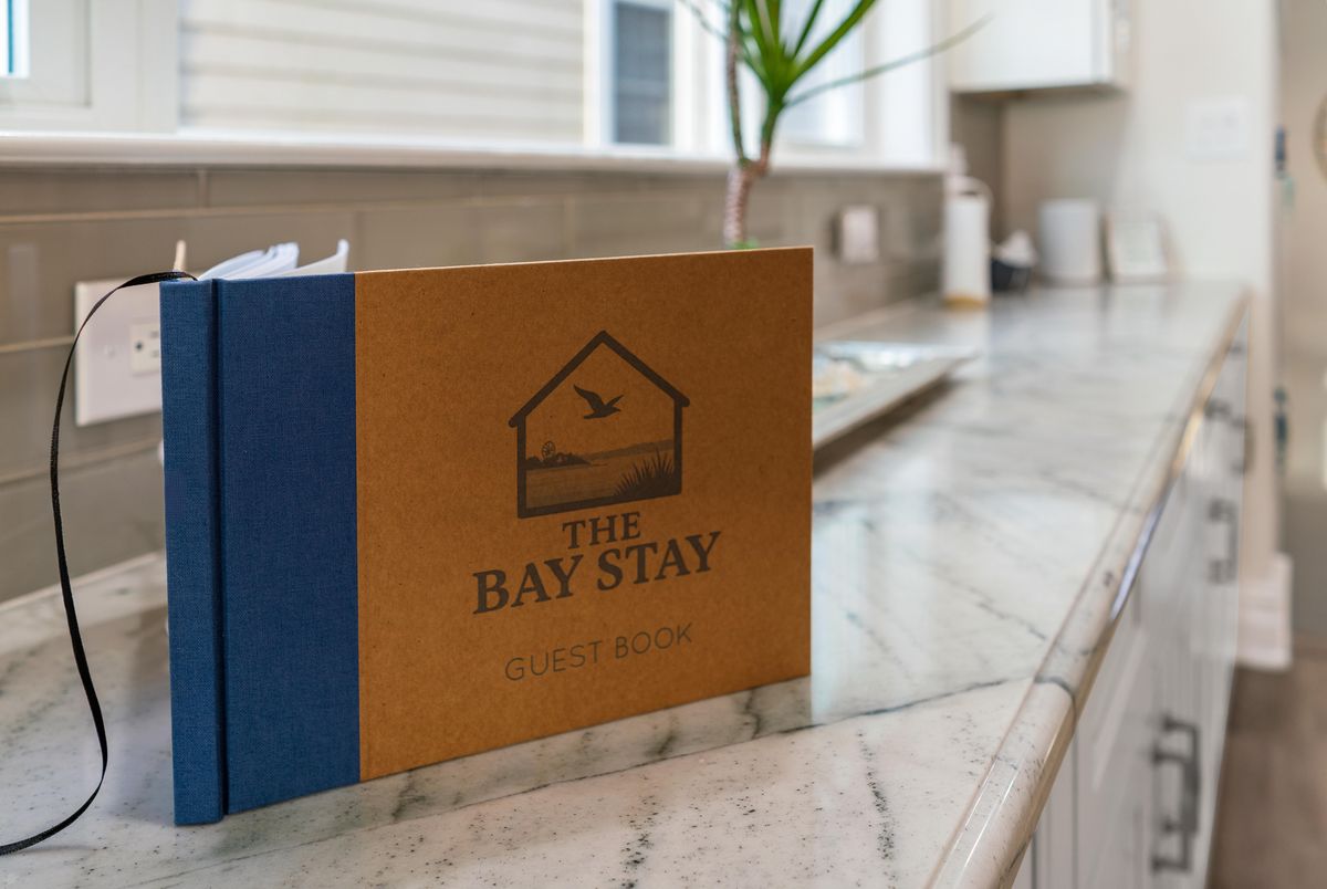 The guest book with the rental's own logo