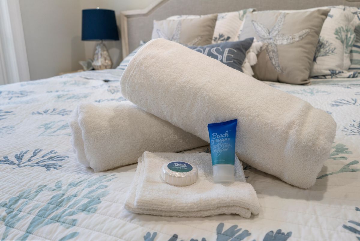 Rolled towels and toiletries ready for guests