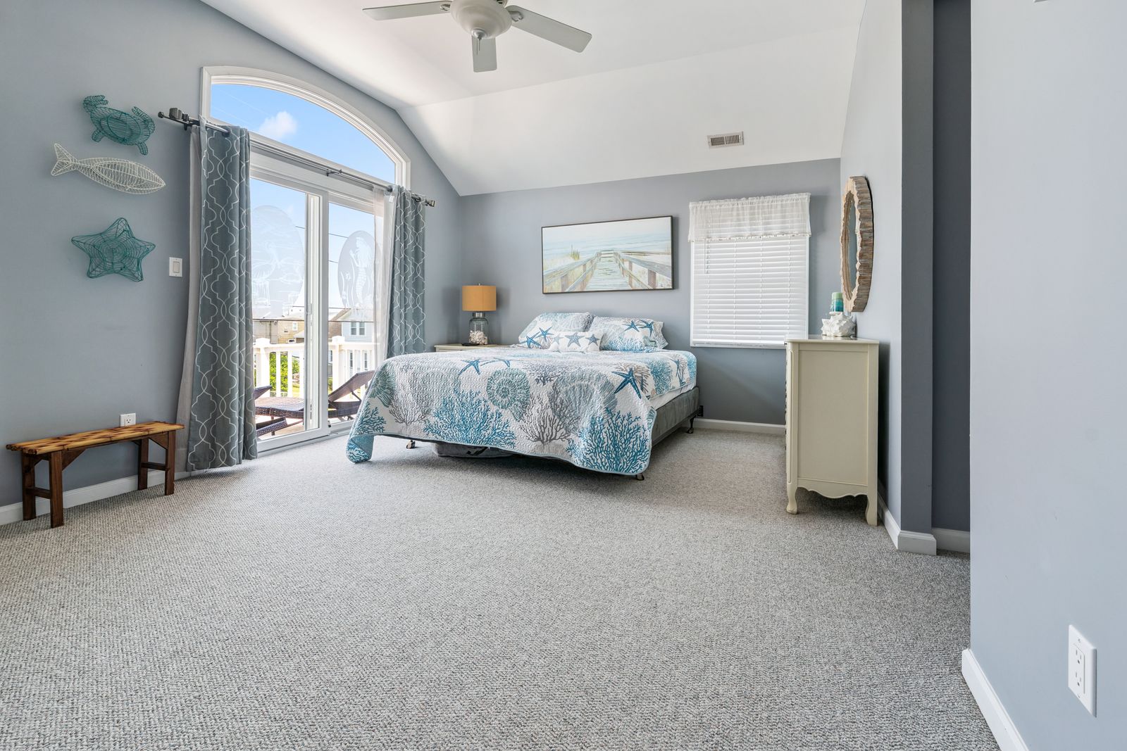 Primary bedroom with sliding door to the balcony