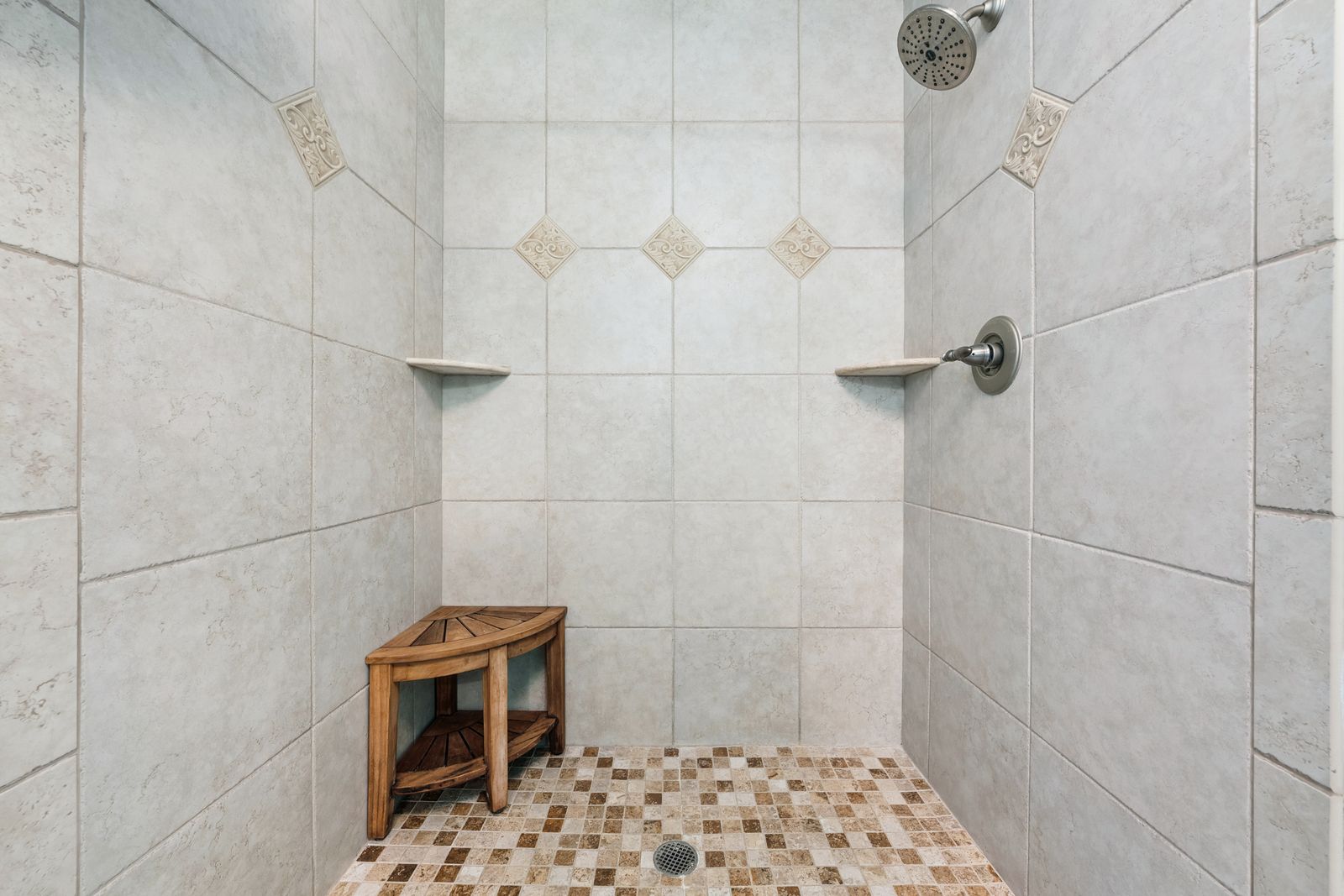Tiled walk-in shower with bench