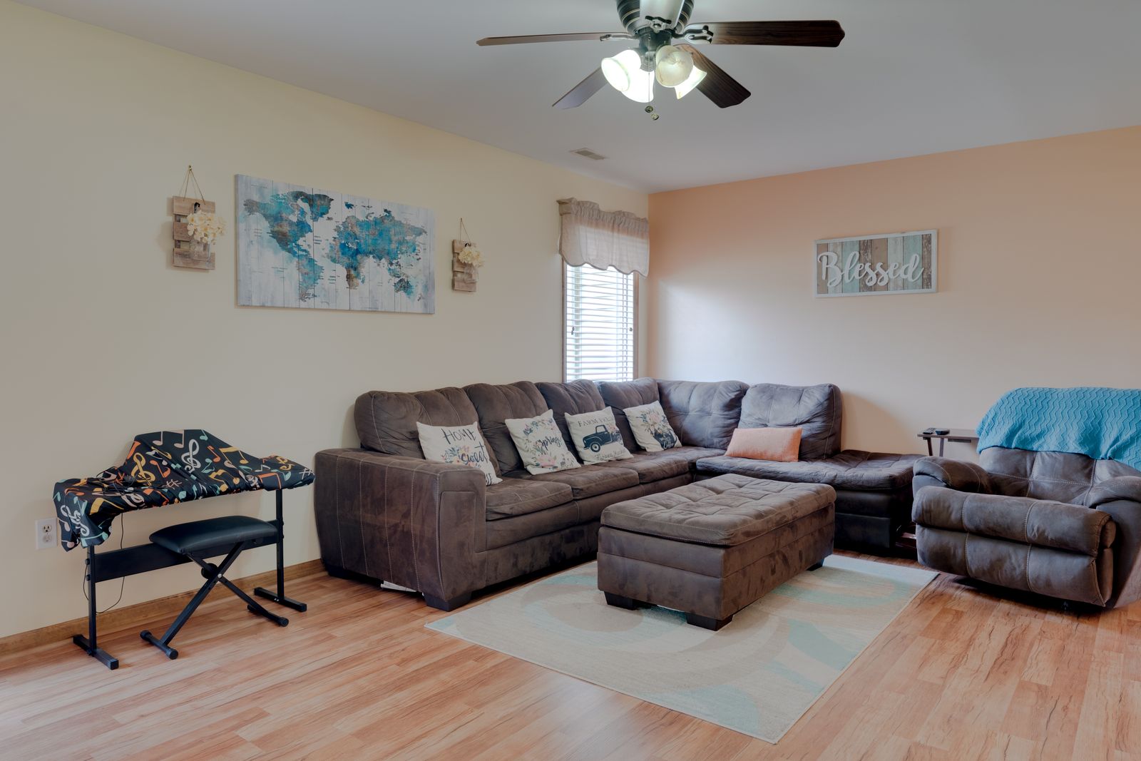 Family room with sectional and big windows