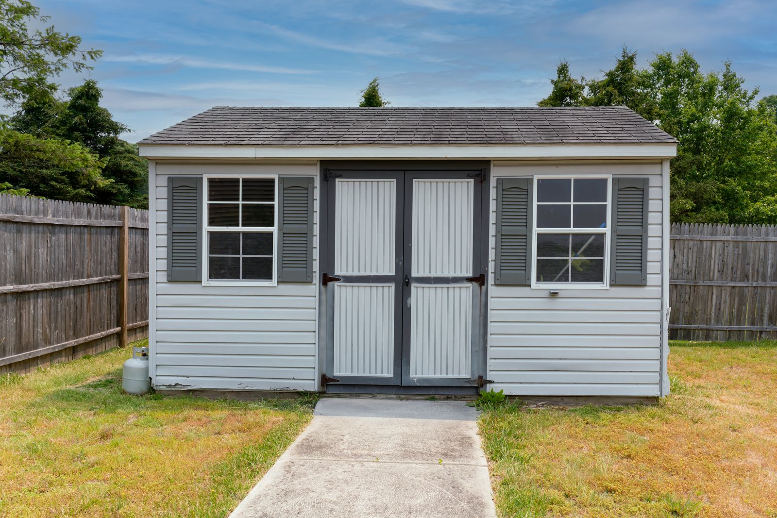 Backyard shed with shutters