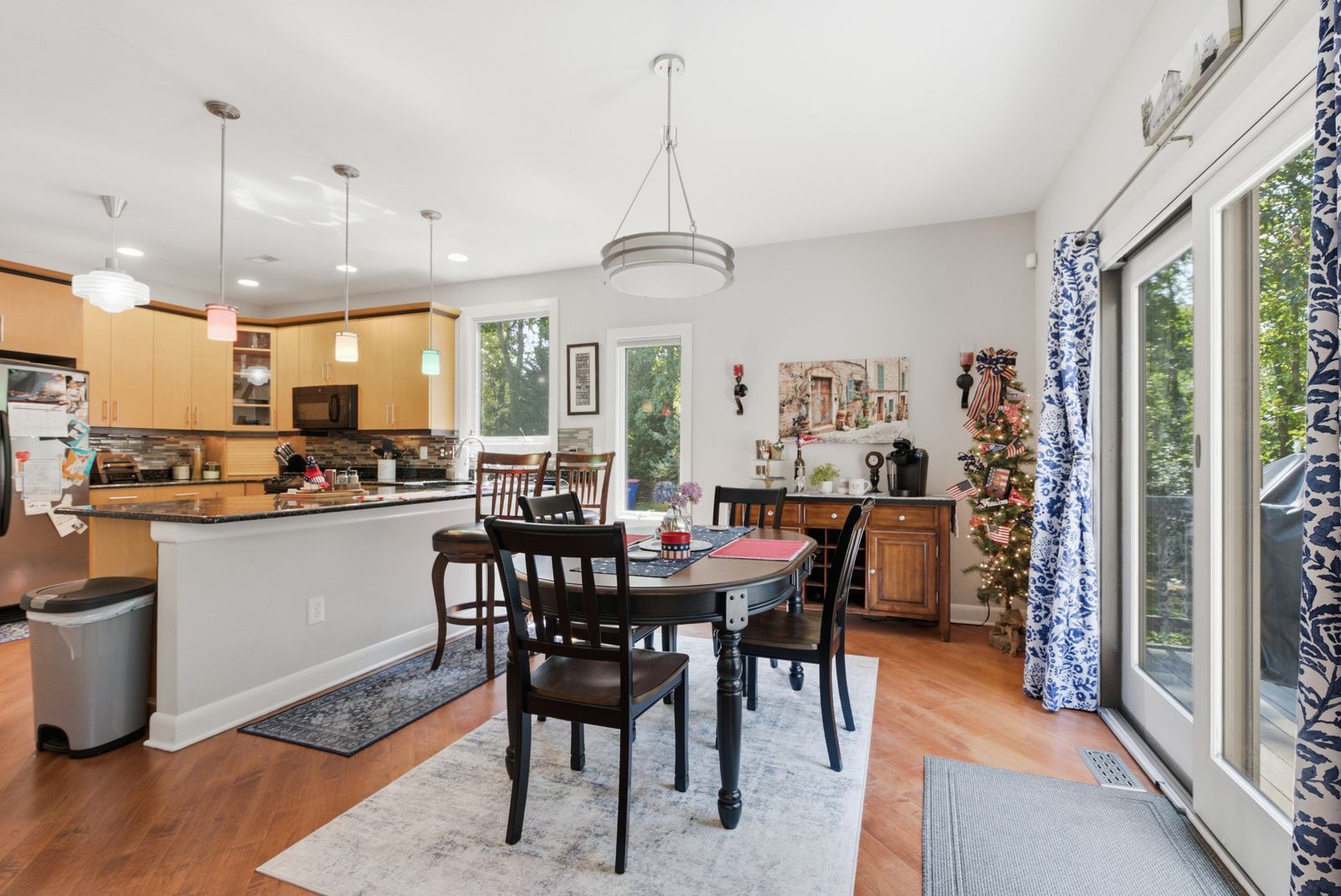 Open kitchen and dining area with sliding doors to the deck