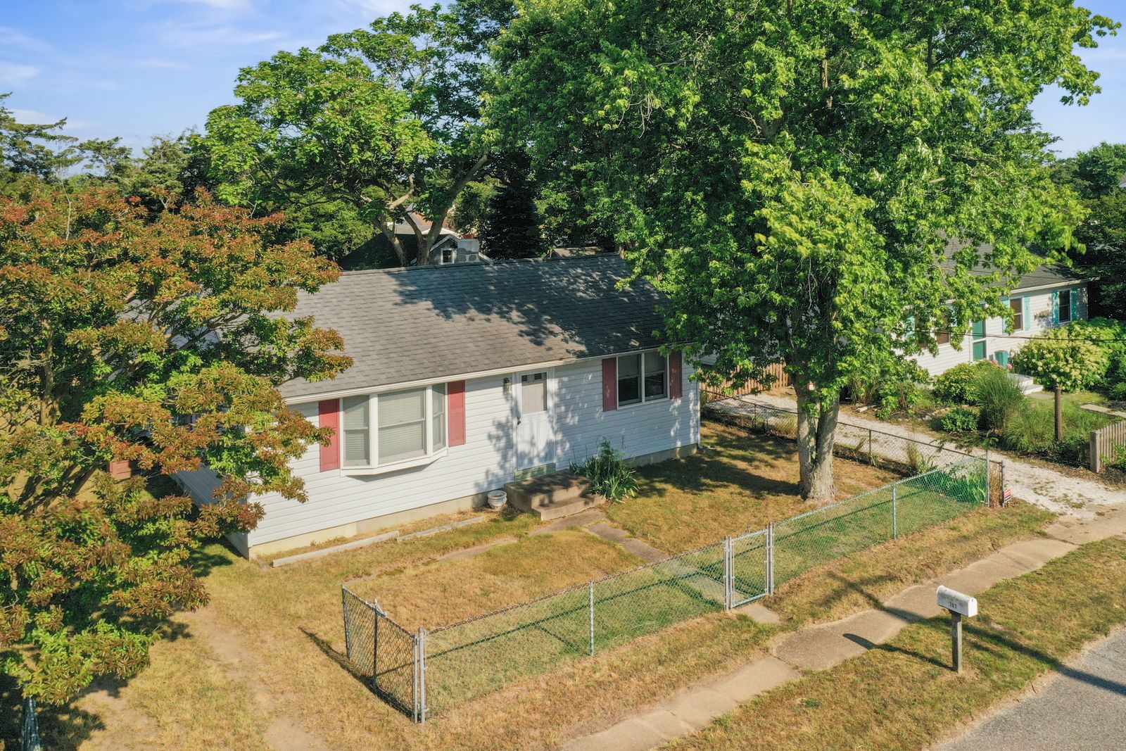 Drone view of the North Cape May NJ ranch and fenced yard