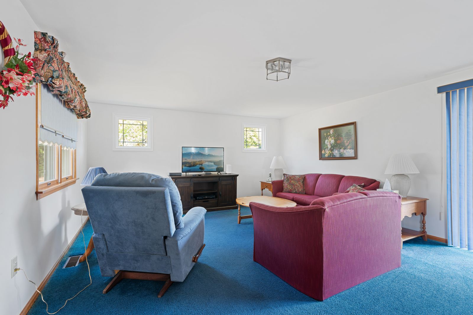 Bright living room with ceiling light and big windows
