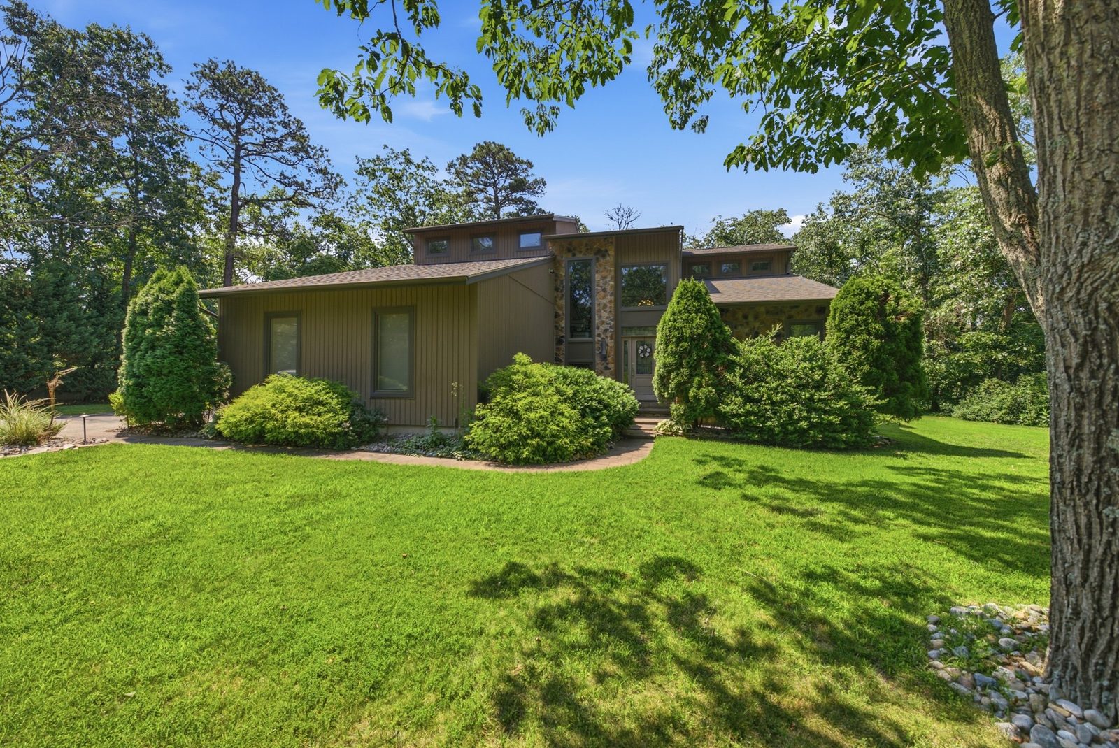 Mid-century modern home exterior with big lawn in Millville NJ