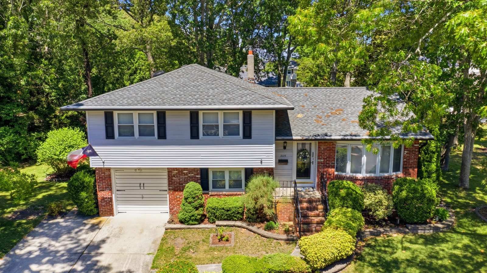 Drone aerial of a Somers Point NJ home showing the lot and roof