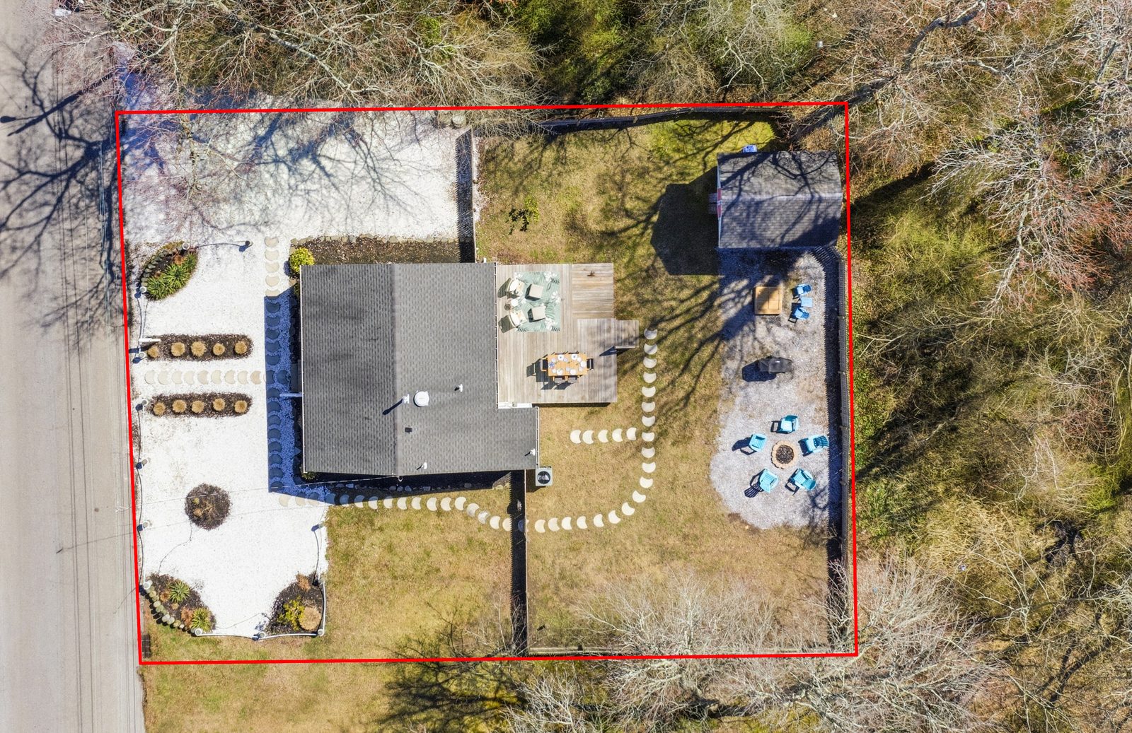 Top-down drone view of a Villas NJ property with outlined lot