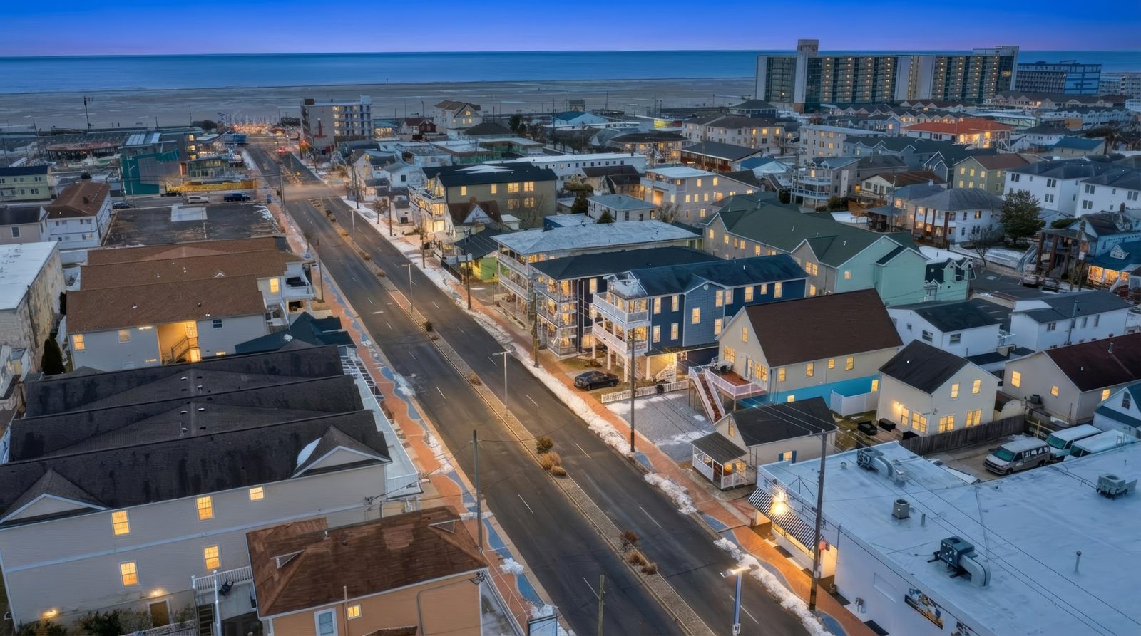Drone aerial of Wildwood NJ at blue hour with the ocean in the distance
