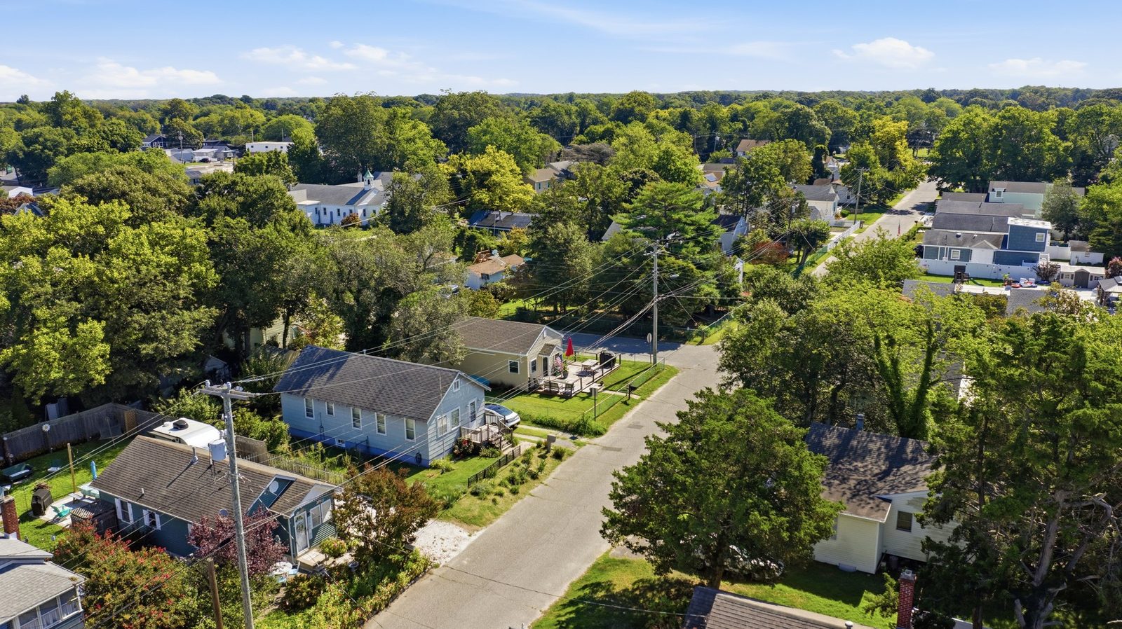 Aerial view over Villas NJ rooftops and tree-lined streets